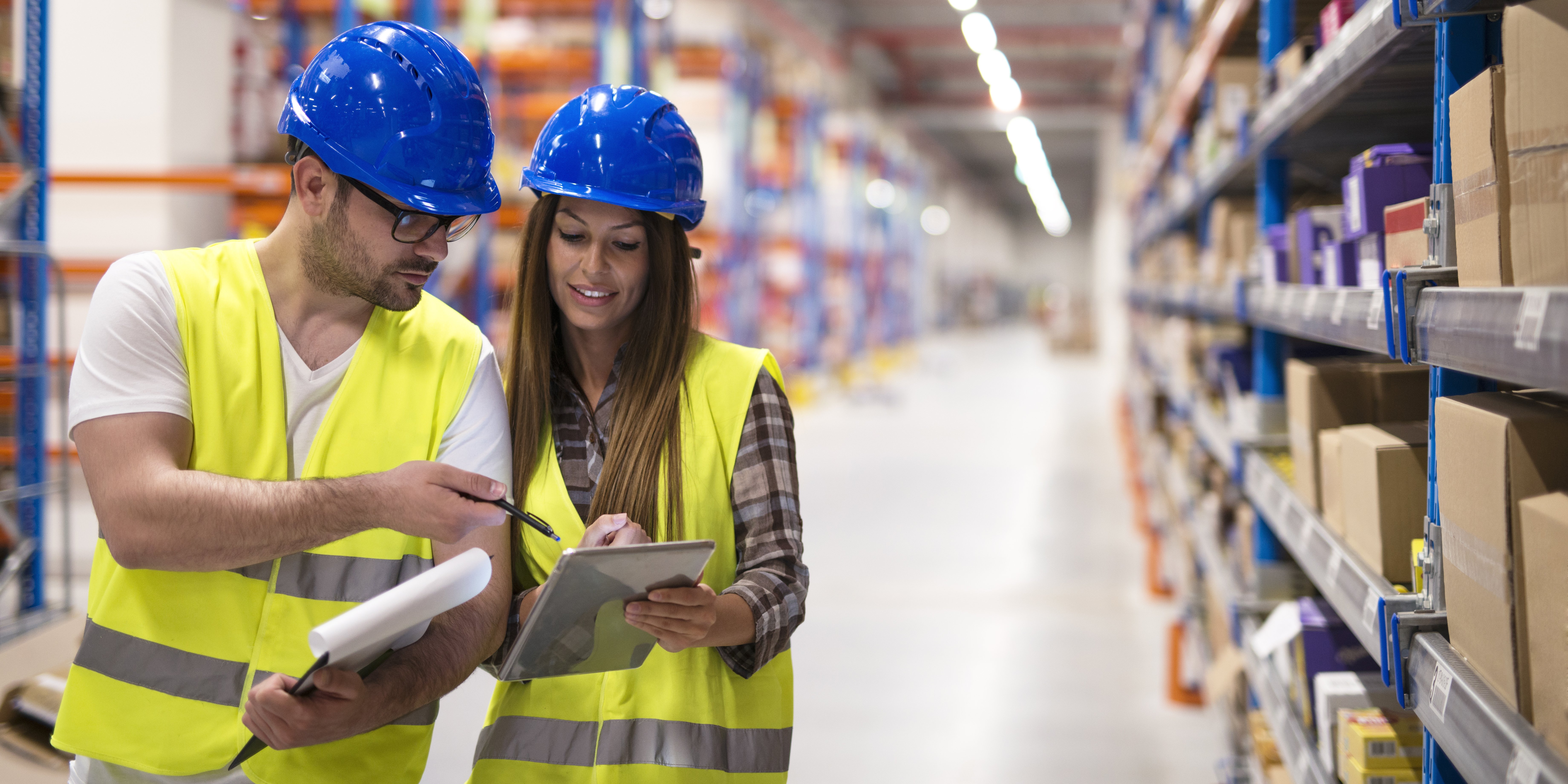 warehouse-workers-checking-inventory-consulting-each-other-about-organization-distribution-goods